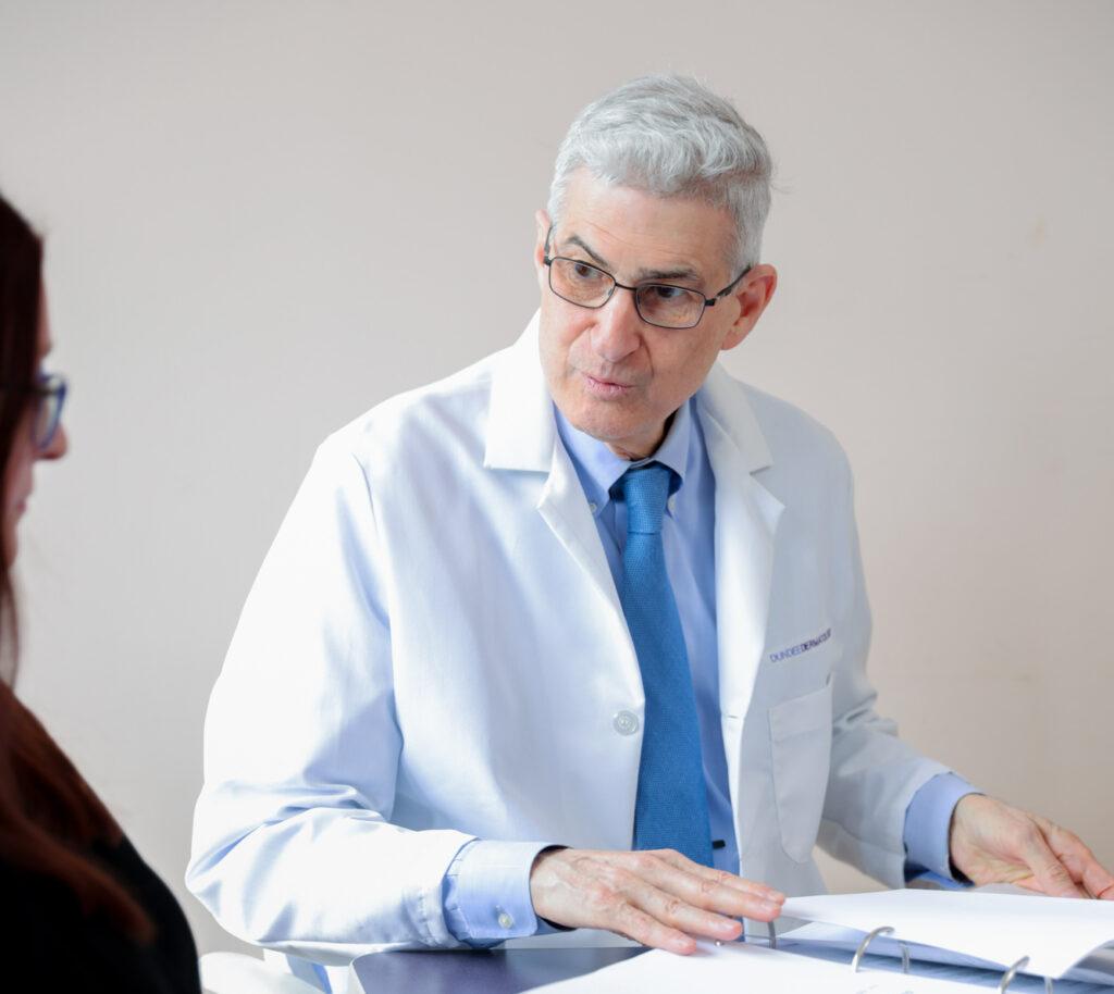 One of our providers sits with a patient and discusses the Exomind OCD treatment in Elgin.